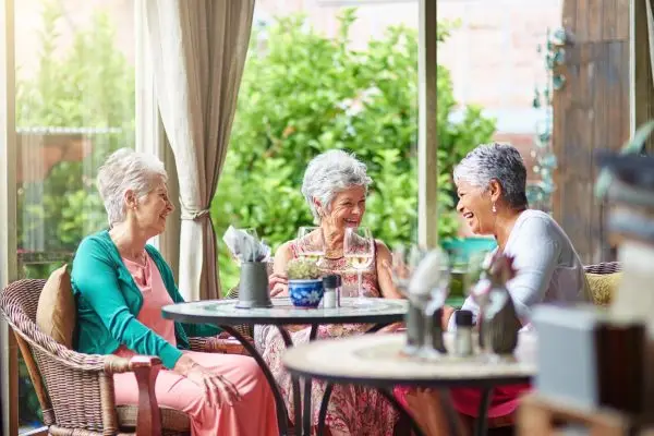 Cropped shot of a group of senior female friends enjoying a lunch date